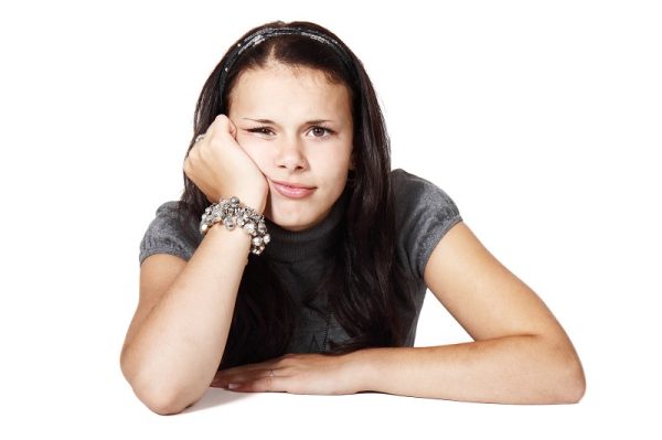 Bored girl leaning chin on hand