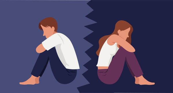 Boy and girl sitting back to back upset